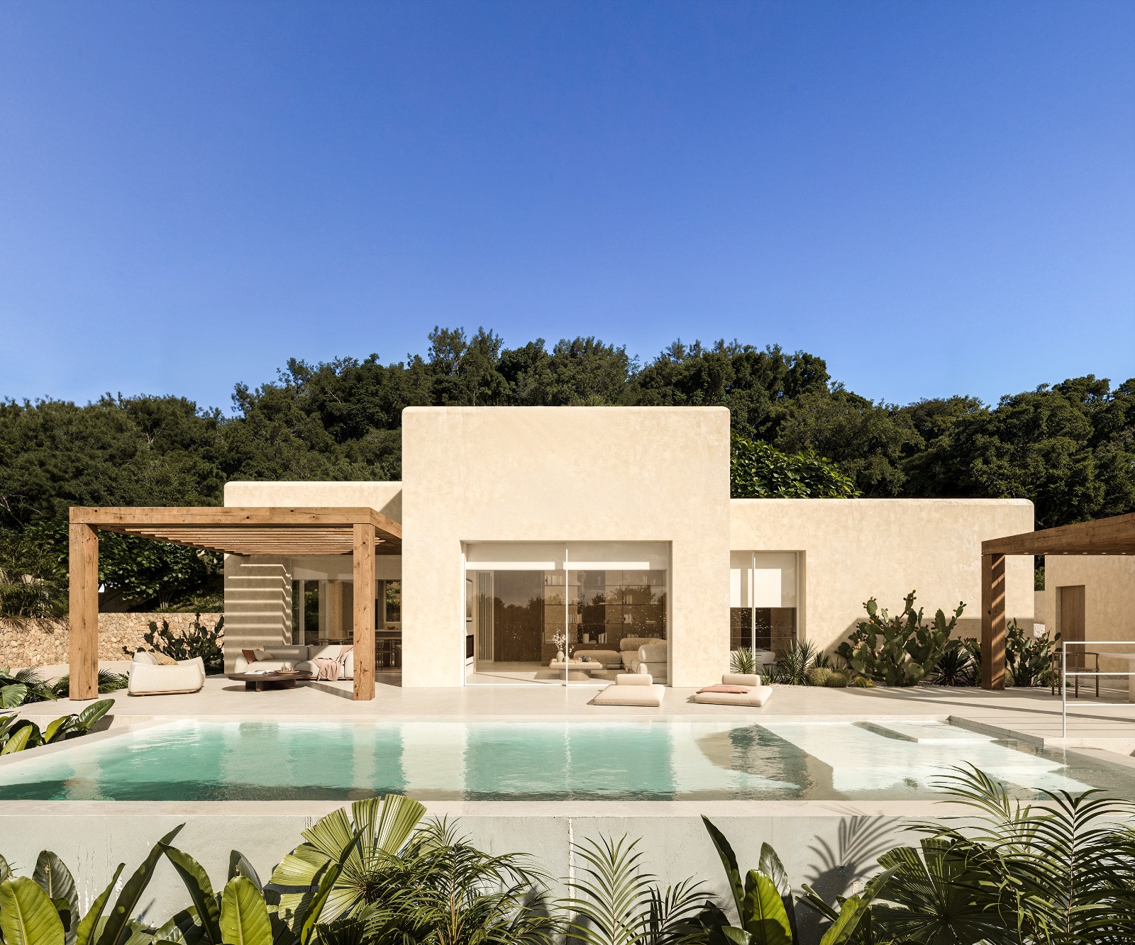 Fachada principal y piscina de la villa